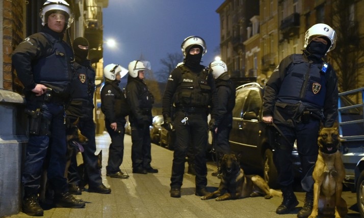 Belgian police forces stand guard in a street during a police action in the Molenbeek-Saint-Jean district in Brussels, on March 18, 2016. A police operation was underway on March 18, in the Brussels area home to key Paris attacks suspect Salah Abdeslam whose fingerprints were found in an apartment raided this week, the federal prosecutor's office said. AFP PHOTO / JOHN THYS / AFP / JOHN THYS (Photo credit should read JOHN THYS/AFP/Getty Images)