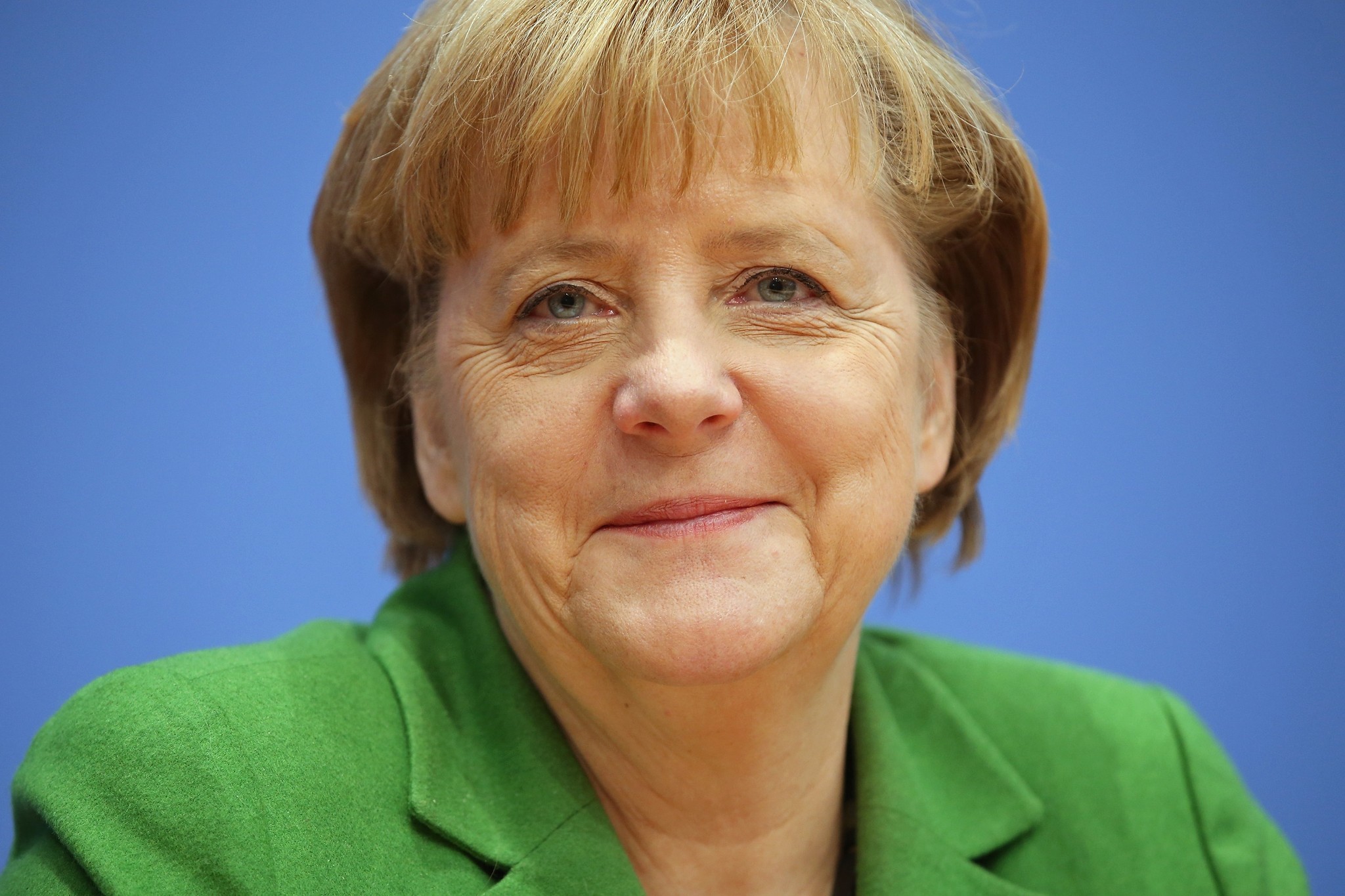 BERLIN, GERMANY - NOVEMBER 27: German Chancellor and Chairwoman of the German Christian Democrats (CDU) Angela Merkel talks to the media with Chairman of the German Social Democrats (SPD) Sigmar Gabriel and Chairman of the Bavarian Christian Democrats (CSU) Horst Seehofer (not pictured) about the three parties' coalition contract after signing it earlier in the day on November 27, 2013 in Berlin, Germany. The three parties worked their way through arduous negotiations on policy issues that concluded with a 17-hour overnight session last night in order to hammer out the final details that will make a new German coalition government possible. The agreement still requires approval by party delegates, which especially in the case of the SPD is uncertain. (Photo by Sean Gallup/Getty Images,) ** OUTS - ELSENT, FPG, TCN - OUTS * NM, PH, VA if sourced by CT, LA or MoD **