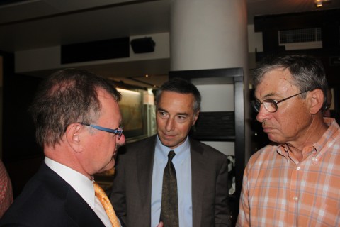 Harvard Business School Professor, John Quelch (left)  talks to MIT professors Richard Locke (center) and Thomas Kochan (right).