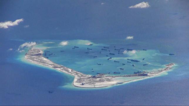 Chinese dredging vessels are purportedly seen in the waters around Mischief Reef in the disputed Spratly Islands in the South China Sea this still image from video taken by a P-8A Poseidon surveillance aircraft May 21, 2015. REUTERS/U.S. Navy/Handout via Reuters