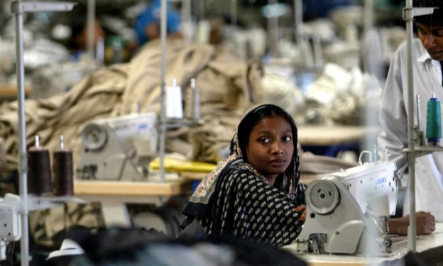 A Bangladeshi woman works in a textile factory on the outskirts of Dhaka, Bangladesh, Wednesday, Feb. 2, 2005. (Manish Swarup/AP)